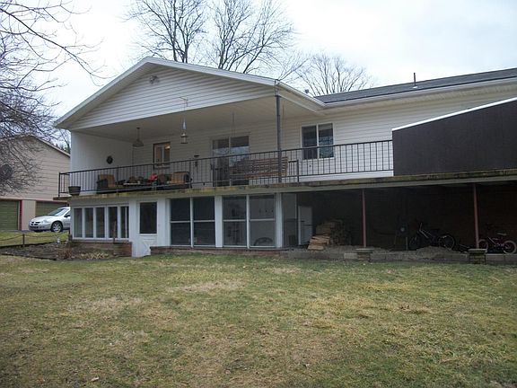 Back patio, sun room and covered porch.