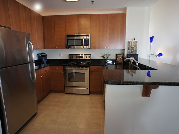 Kitchen with granite countertops and stainless appliances
