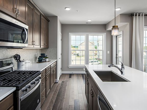 Model Representation - Stunning Kitchen with Stainless Steel Appliances