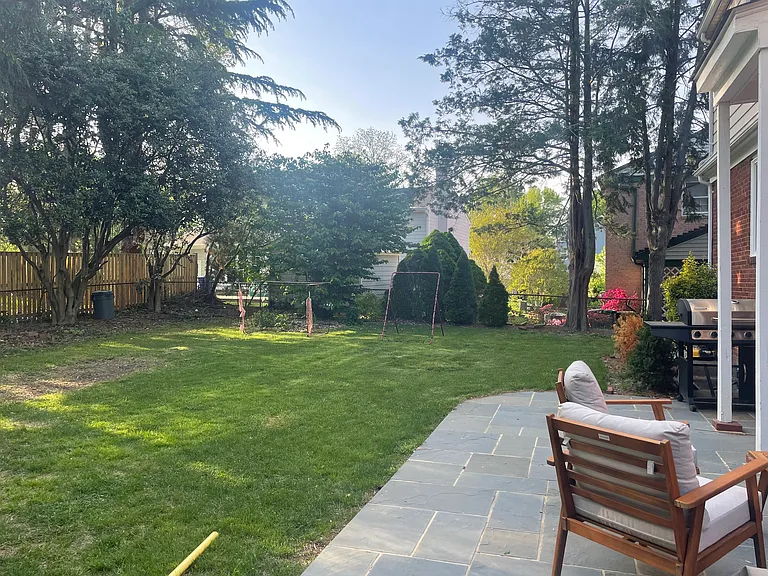 Flat, fenced-in back yard with Pennsylvania bluestone patio.