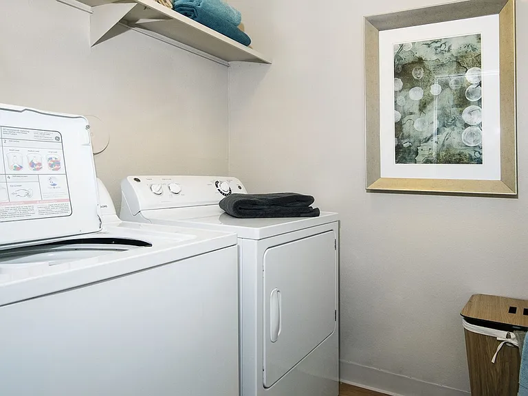 In unit laundry room with washer and dryer