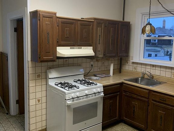 Kitchen with new stove and hood