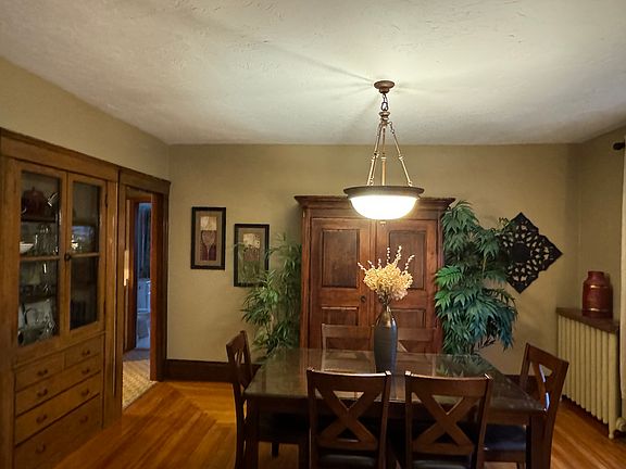 Elegant dining room to enjoy meals or can be utilized as a work space . The armoire is stocked with bath towels, a blow dryer and additional linens. The built-in hutch is stocked with wine glasses, shot glasses, presentation bowls, platters and much more.