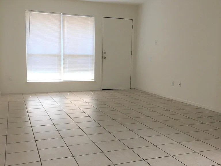 Spacious living room and dining room combo. The unit was recently rebuilt including the walls, doors, fixture, energy saving windows, and ac system.