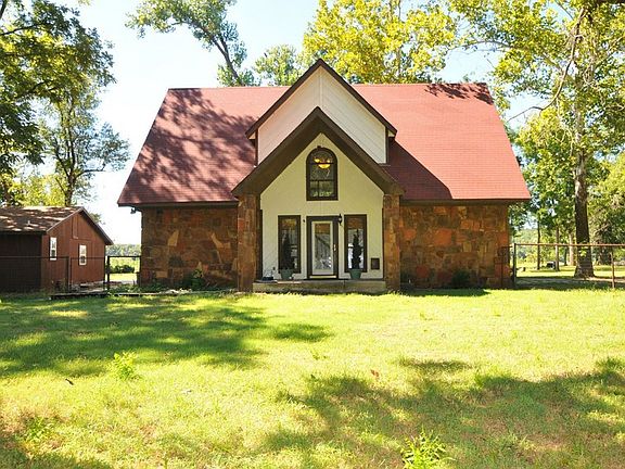 Front of house
						:
						View from fenced yard. Cottage is on the left. The roof is new.