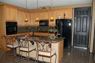 Dining Bar and Upgraded Counters, Flooring, and Appliances.