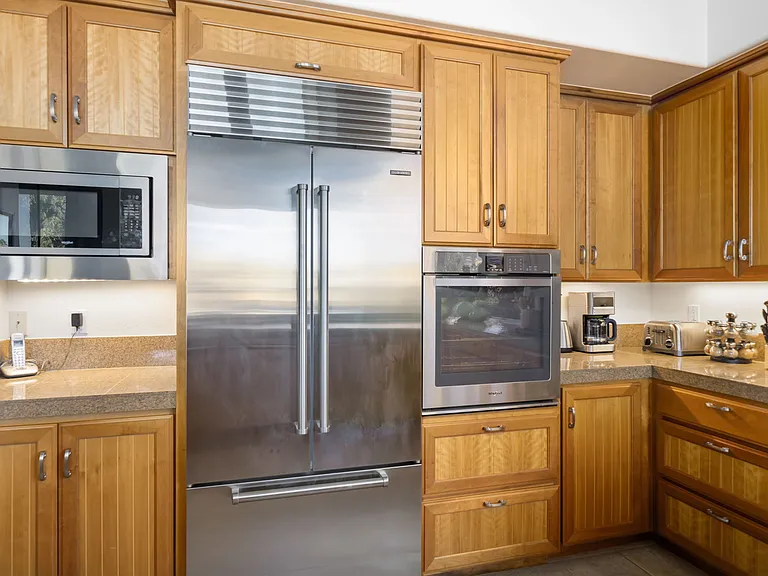 Kitchen with sub-zero refrigerator.