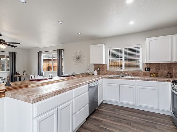 Kitchen craft cabinets that have been professionally painted with bottom pullout shelving and two lazy Susan cabinets.