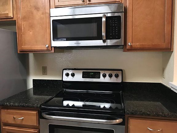 Kitchen with Maple cabinets and granite.