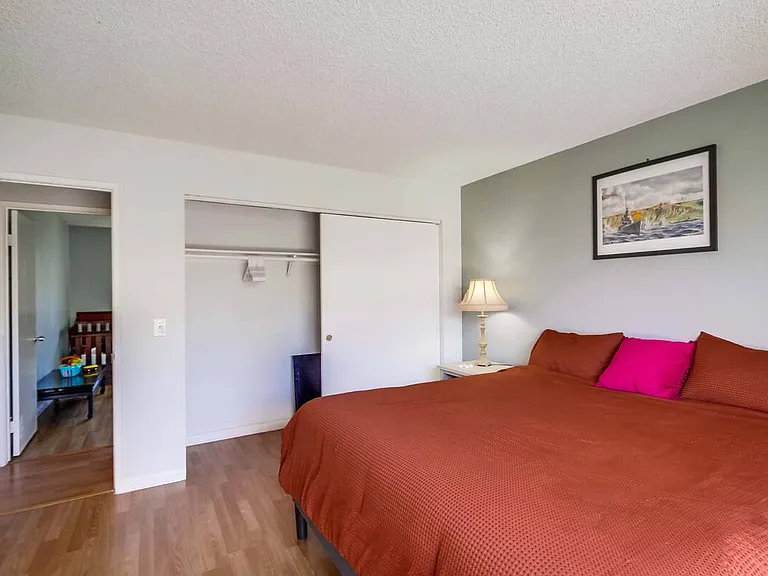 Spacious room with a king bed and dedicated workspace for ultimate comfort.