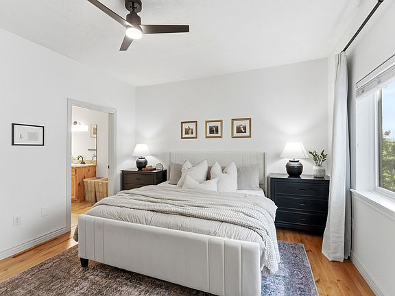 Large master bedroom with king bed and dressers, and ensuite master bathroom