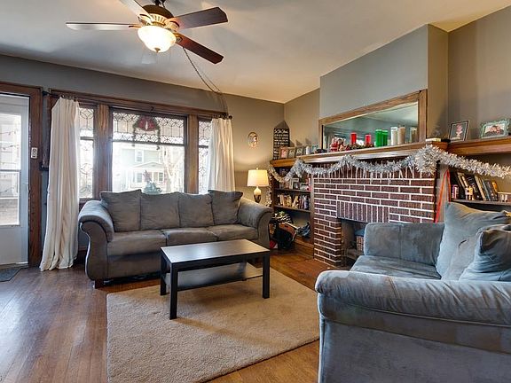 Living Room with Fireplace and Ceiling Fan