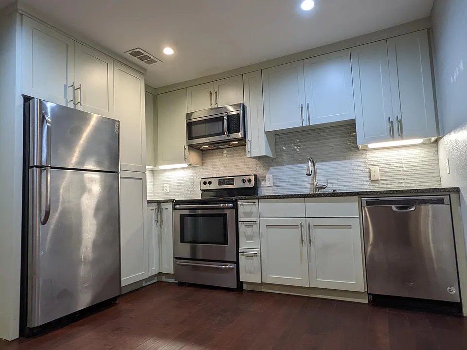 Plethora amount of cabinet space in this custom kitchen