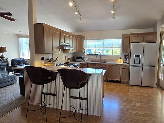 Newly refreshed open-plan living room and kitchen.