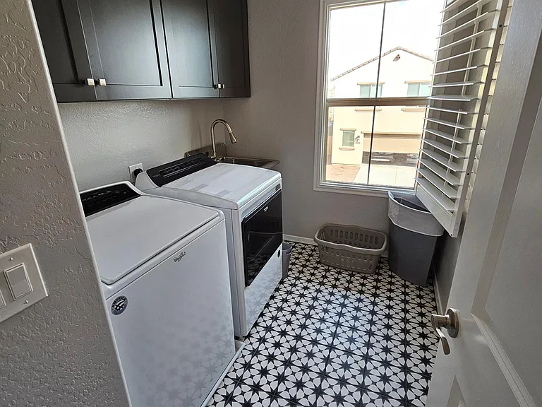 Laundry room w/ utility sink, ironing board