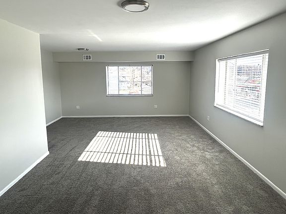 Entrance to apartment view of Living room. Fantastic natural lighting.