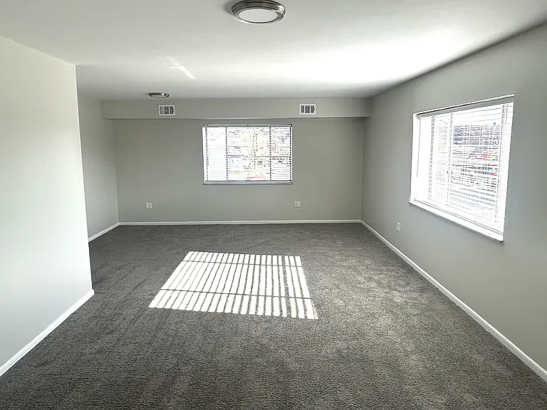 Entrance to apartment view of Living room. Fantastic natural lighting.