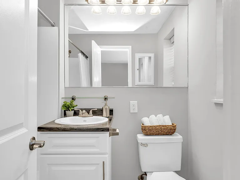 Start your day with bathroom bliss at Beacon Square. An oversized mirror adds space, light, and a dash of luxury to your routine.