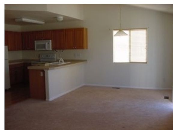 Kitchen and dining, door to back yard to right
