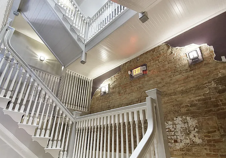 Dramatic original staircase in the common area