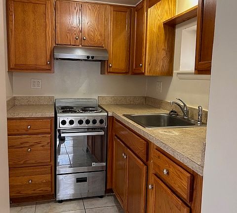 Full Kitchen, newer cabinets, new paint .