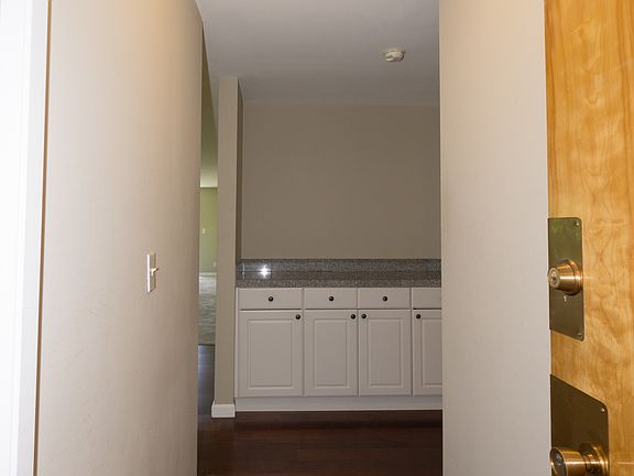Welcoming Entrance with Custom Cabinets & Brazilian Cherry Flooring