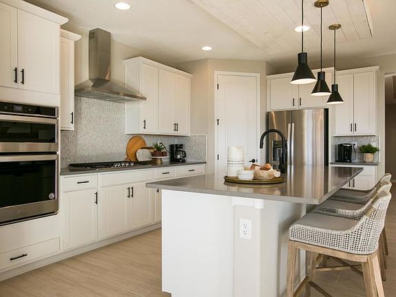 Built-in stainless steel appliances including gas cooktop range takes cooking to the next level in y