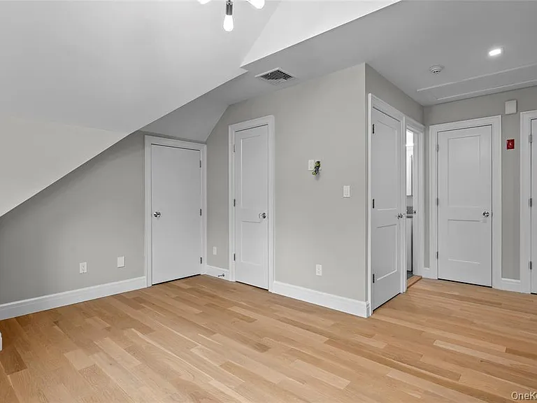 Lofted space with closets, a full bath with tub/shower combo and washer/dryer