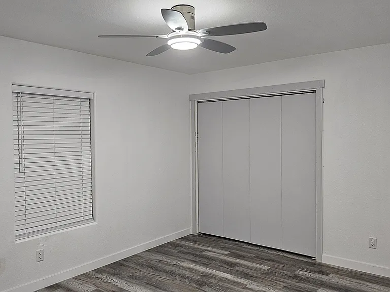 Bedroom - 2 Closet Doors and window