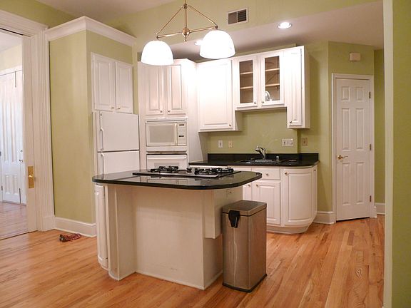 Kitchen open to living room through original pocket doors