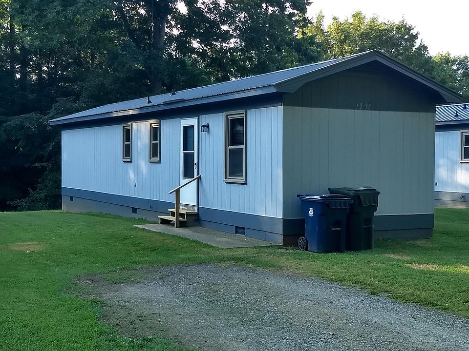 Front of house with driveway.