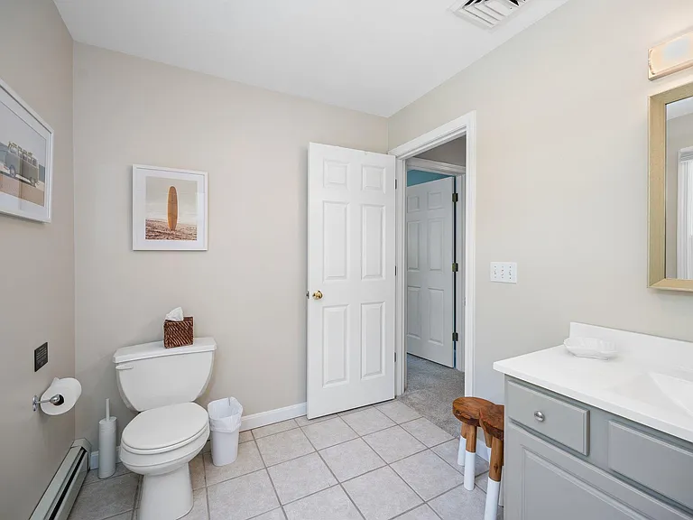 2nd floor shared bathroom with green & blue rooms.