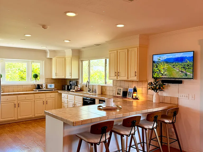 Supersized kitchen with eating bar area although plenty of room for a table and chairs.