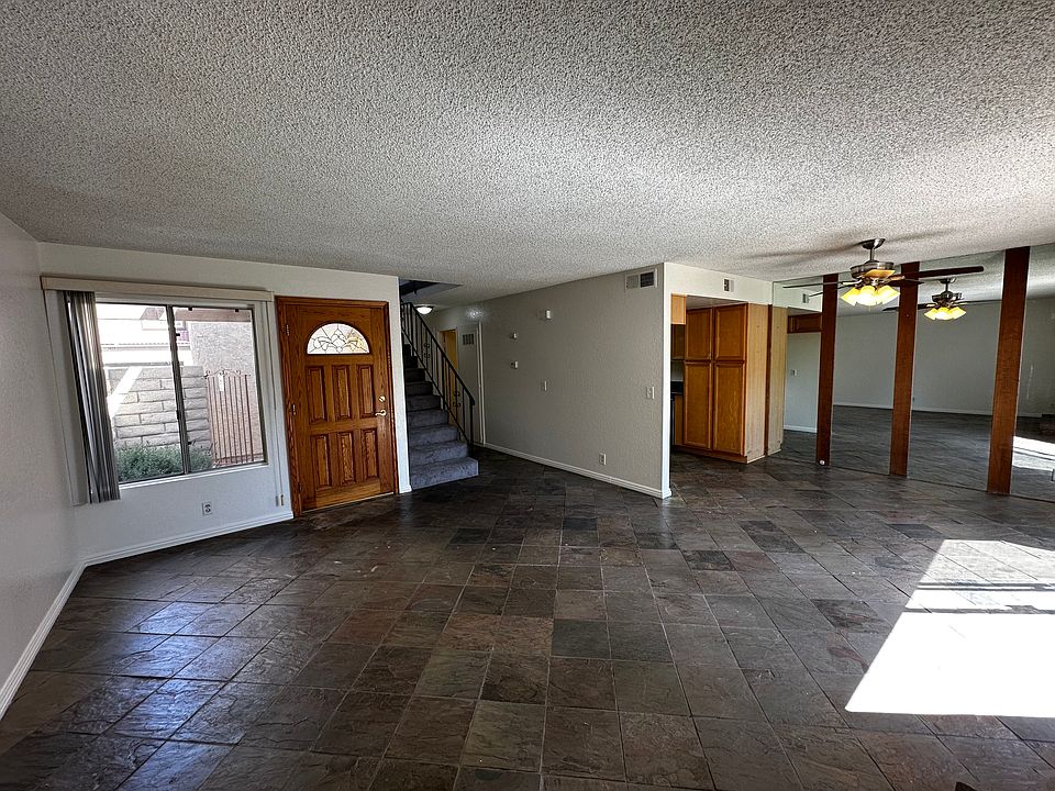 Living room, dining room, and base of stairs