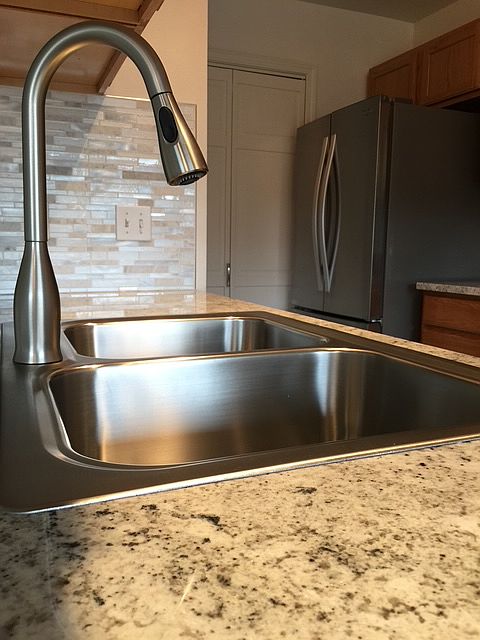 Granite countertops, stainless steel appliances, pantry