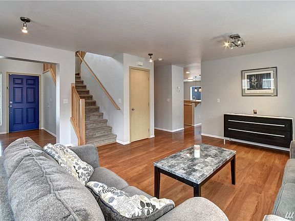 Tucked away staircase opening up the foyer.