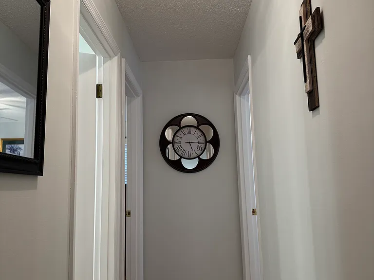 Hallway to main bath and bedrooms.