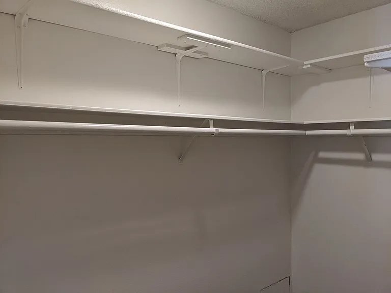 Bedroom walk-in closet at the Steckel Apartments in Santa Paula, California.