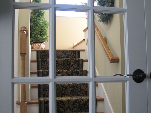 View of wood stairs from office