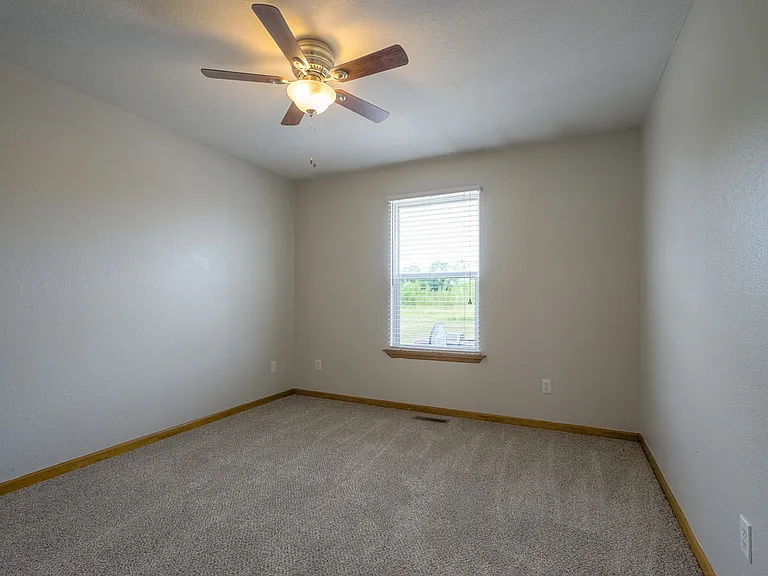 2nd upstairs bedroom with satin nickel lighted ceiling fan