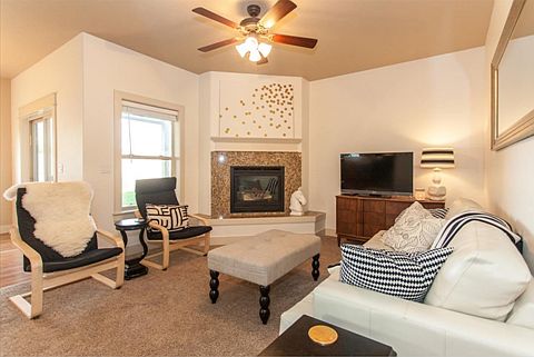 Living area of the great room with a beautiful gas fireplace.