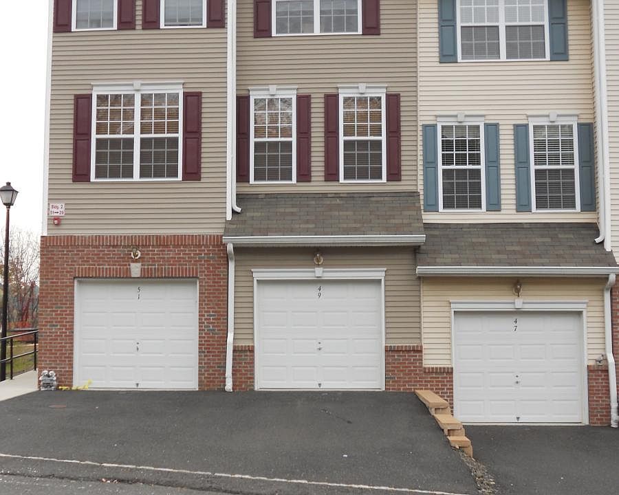 View of garage and driveway