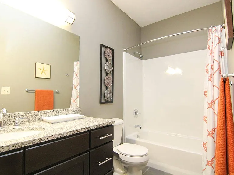 Curved shower rods provide extra elbow room in the shower.