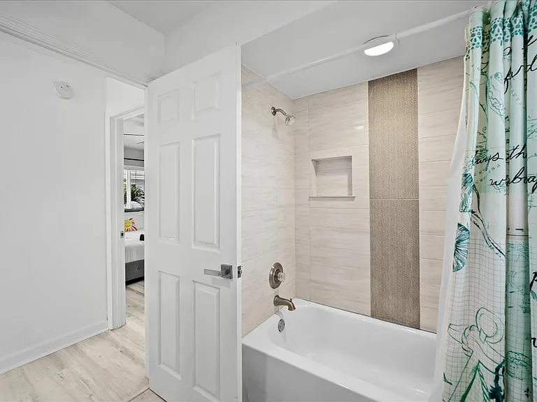 Bathroom upstairs with shower and tub