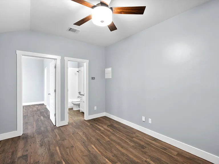 Upstairs flex area leading into bathroom and 3rd bedroom