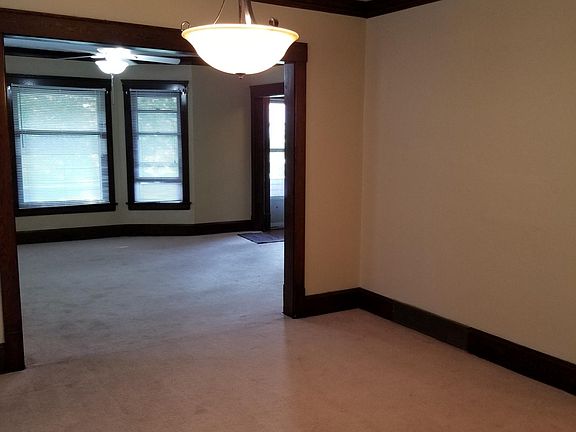 Large Dining Room with nice chandelier and Large Living room with bay window