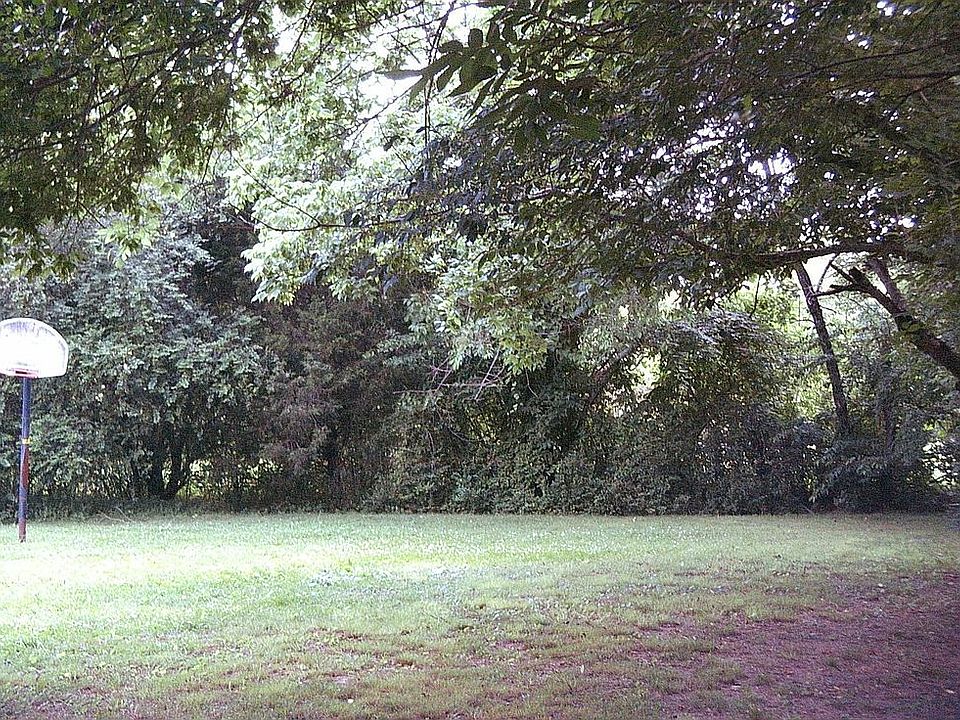 HUGE backyard!  Kids paradise or gardners dream w/pecan & walnut trees!