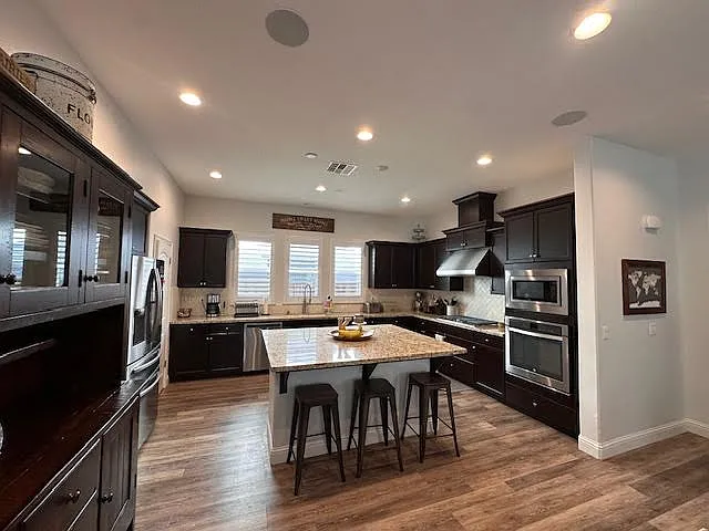 Open Kitchen with oversized island overlooking Greatroom