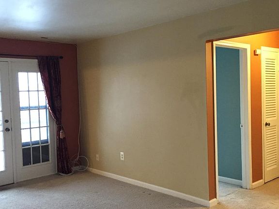 Living room with door out to balcany