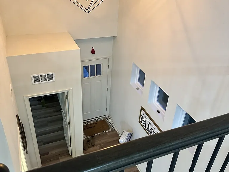 Loft view overlooking the main entrance, with the in-law suite to the left